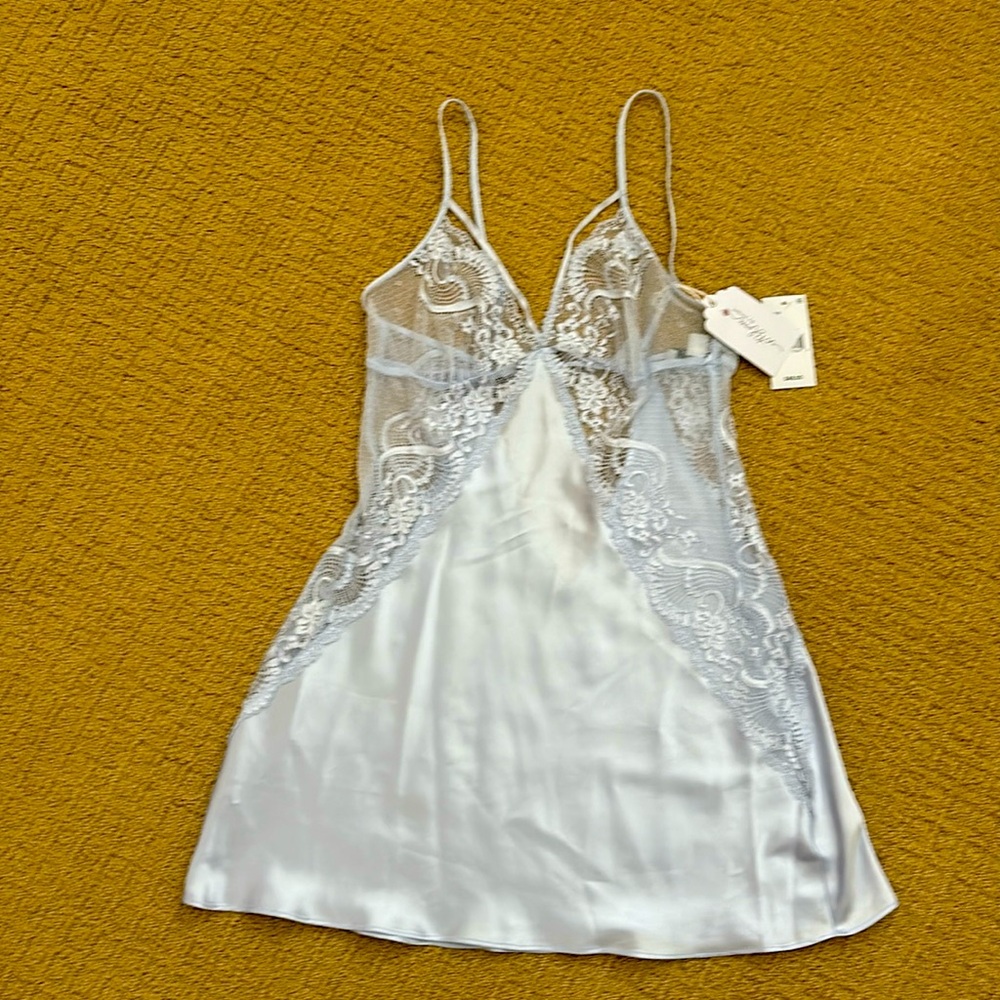 Sexy lingerie with lace covering breast area and extends down the sides & back!